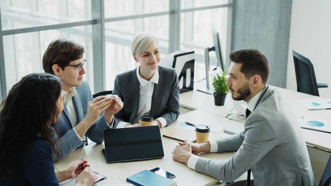 A team of professionals meeting around a table