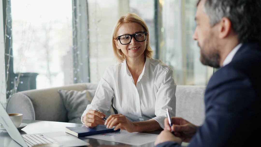 An advisor meeting a client across a table